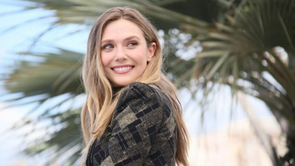 elizabeth olsen smiling outdoors